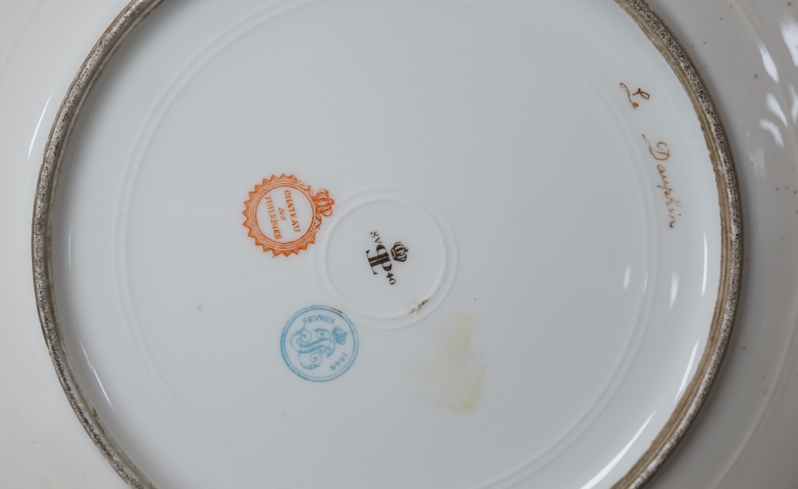 A collection of English porcelain plates, highlights include a Royal Doulton fruit painted cabinet plate signed F Harper, a Royal Worcester flower painted cabinet plate signed E Phillips, and Aynsley plate painted with a